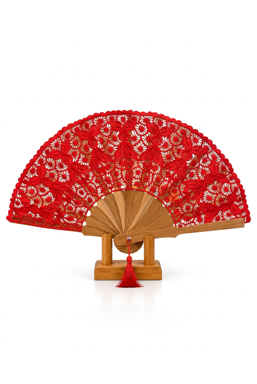 Red embroidered folding fan on wooden stand against a white background